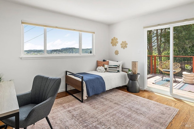 15 Junipero Serra Ave, San Rafael, CA 94901 - bedroom with access to exterior, wood finished floors, and baseboards