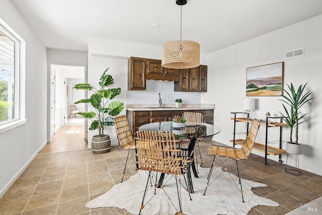 15 Junipero Serra Ave, San Rafael, CA 94901 - dining area featuring light tile patterned floors and baseboards
