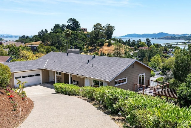 15 Junipero Serra Ave, San Rafael, CA 94901 - ranch-style house featuring a garage, concrete driveway, and a water and mountain view