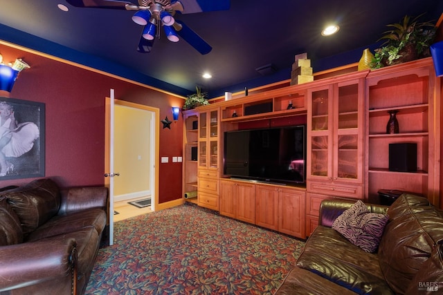 carpeted living area featuring baseboards, a ceiling fan, and recessed lighting