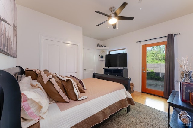 bedroom featuring light wood-style flooring, access to outside, and a ceiling fan