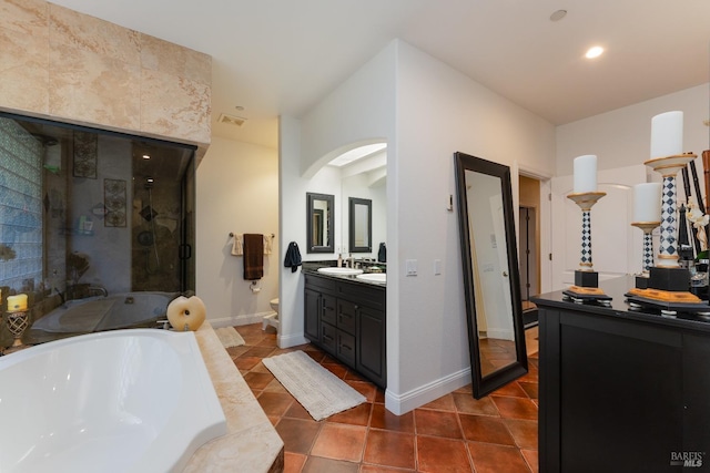 full bath with a stall shower, toilet, visible vents, tile patterned floors, and a garden tub
