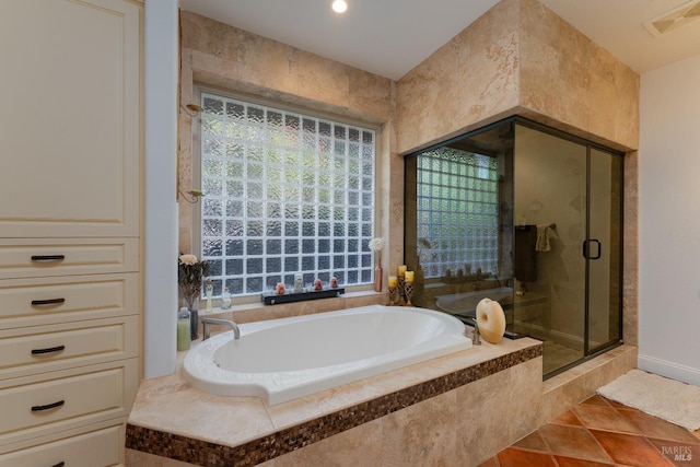 full bath with a stall shower, tile patterned flooring, a garden tub, and visible vents