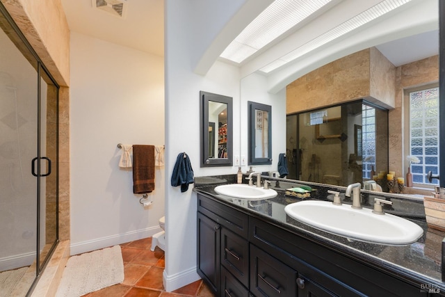 bathroom featuring a stall shower, tile patterned floors, visible vents, and a sink