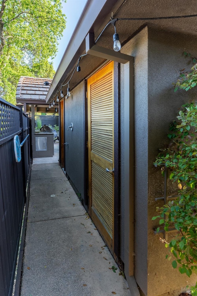 view of side of property with stucco siding