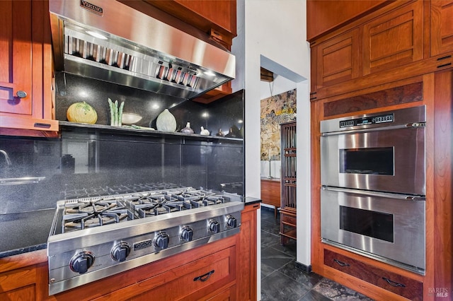 2300 S St, Eureka, CA 95501 - kitchen with appliances with stainless steel finishes, exhaust hood, backsplash, and brown cabinetry