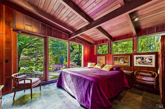 2300 S St, Eureka, CA 95501 - bedroom featuring stone tile flooring, wood ceiling, beamed ceiling, and wooden walls