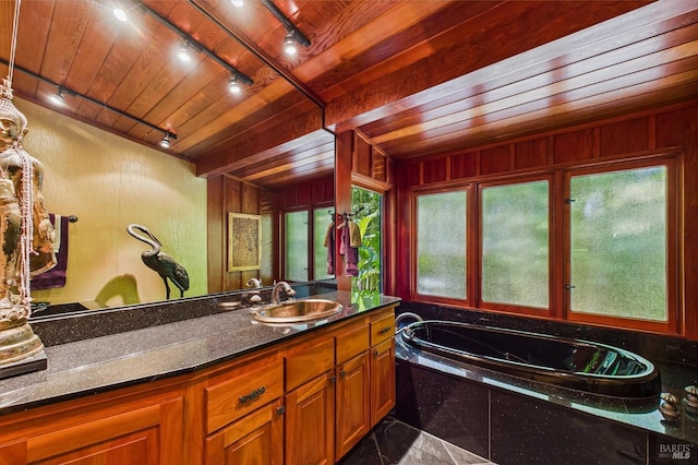 2300 S St, Eureka, CA 95501 - full bathroom featuring rail lighting, vanity, a bath, and wooden walls