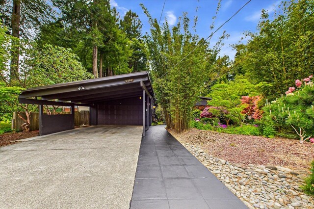 2300 S St, Eureka, CA 95501 - garage with concrete driveway, a carport, and fence