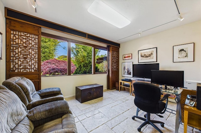 2300 S St, Eureka, CA 95501 - office area featuring track lighting, stone tile floors, and baseboards