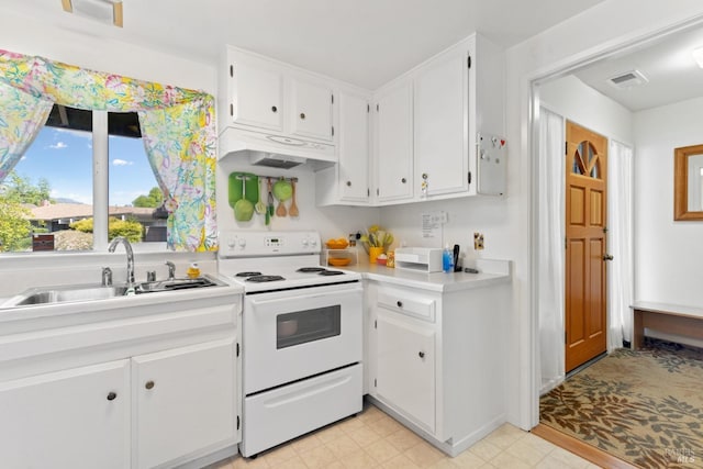 408 White Oak Dr, Santa Rosa, CA 95409 - kitchen with white electric stove, a sink, white cabinets, under cabinet range hood, and light countertops