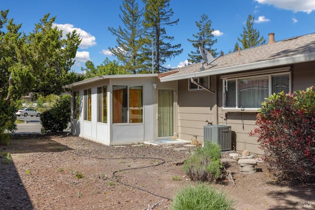 408 White Oak Dr, Santa Rosa, CA 95409 - rear view of property with central AC, a sunroom, and roof with shingles