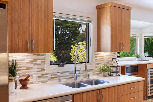 7301 Baker Ln, Sebastopol, CA 95472 - kitchen featuring a sink, decorative backsplash, light countertops, and appliances with stainless steel finishes