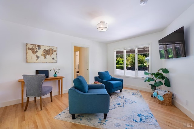 7301 Baker Ln, Sebastopol, CA 95472 - living area with wood finished floors, baseboards, and a desk
