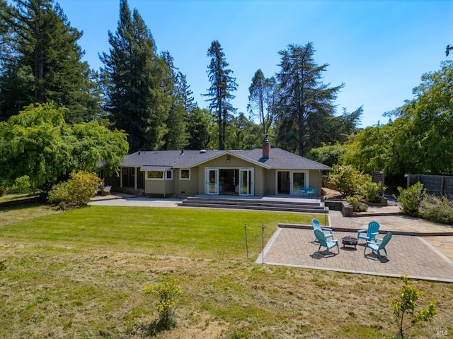 7301 Baker Ln, Sebastopol, CA 95472 - back of house featuring a fire pit, a patio, a chimney, and a yard