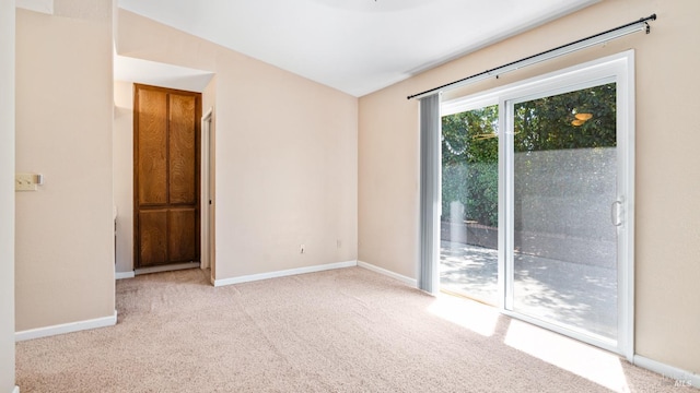 unfurnished room featuring carpet flooring and baseboards