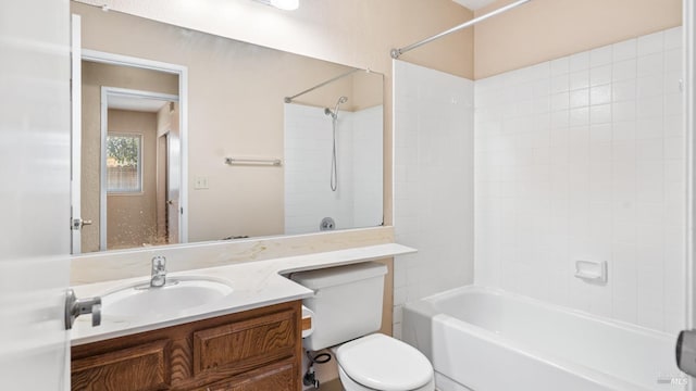 bathroom with toilet, vanity, and shower / tub combination