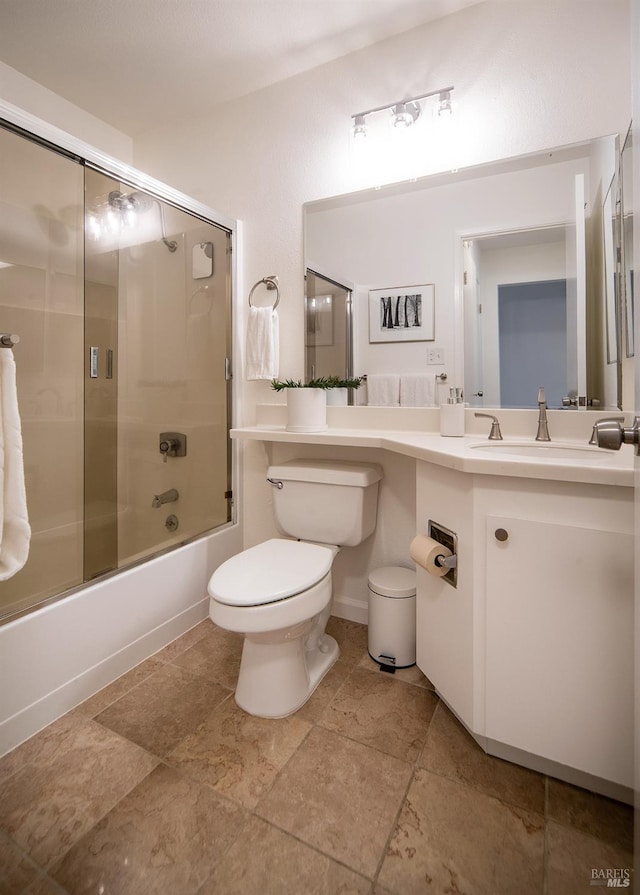 full bathroom with toilet, shower / bath combination with glass door, and vanity