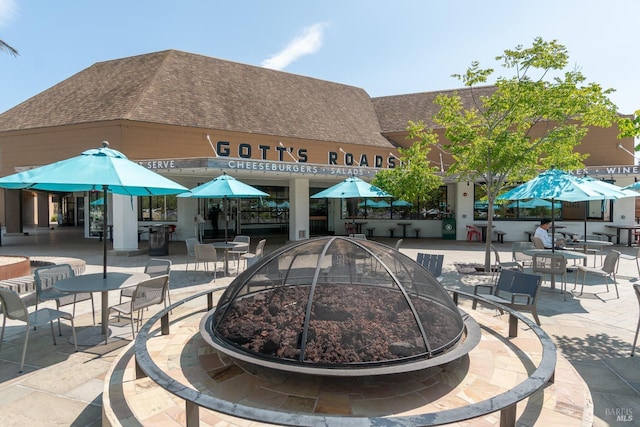 surrounding community featuring a fire pit