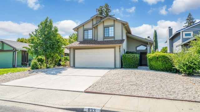 traditional-style house with driveway and a garage