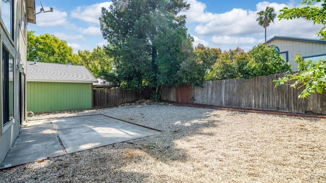 fenced backyard with a patio area