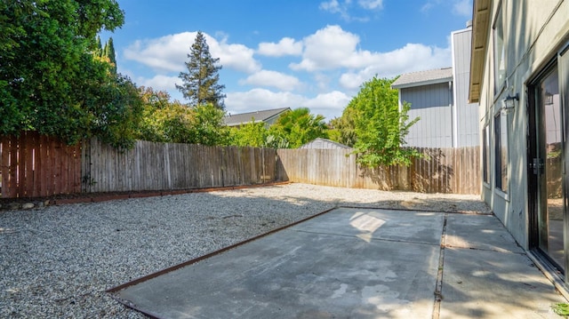 fenced backyard featuring a patio