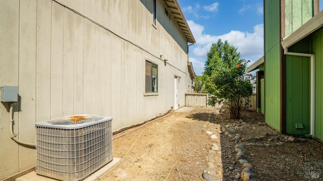 view of side of property featuring central AC
