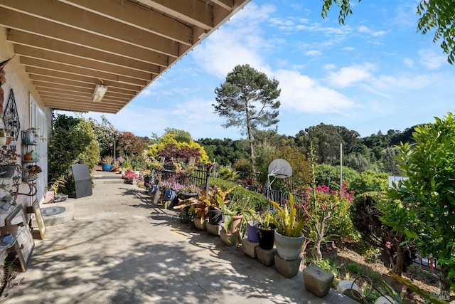 view of home's community with a patio area