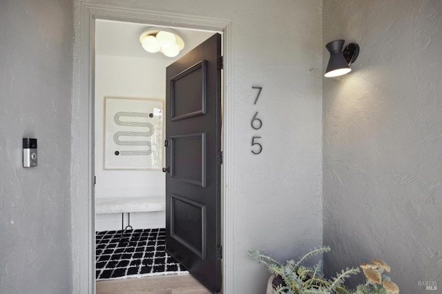 property entrance featuring stucco siding
