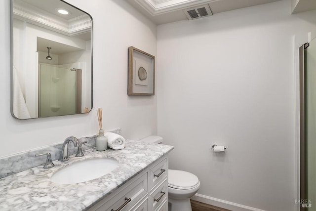 bathroom featuring a shower, toilet, vanity, and wood finished floors