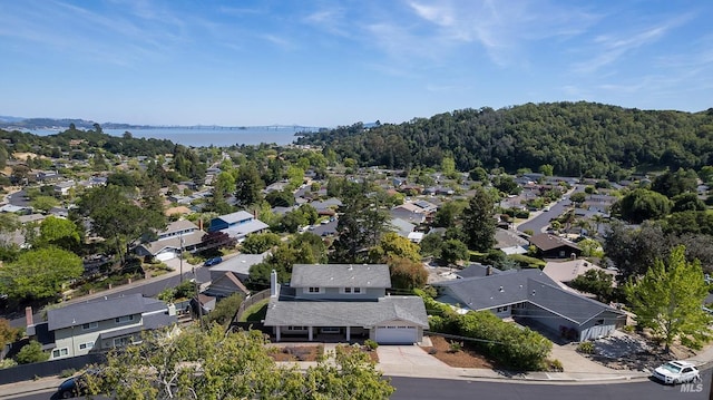 aerial view of residential area with a nearby body of water