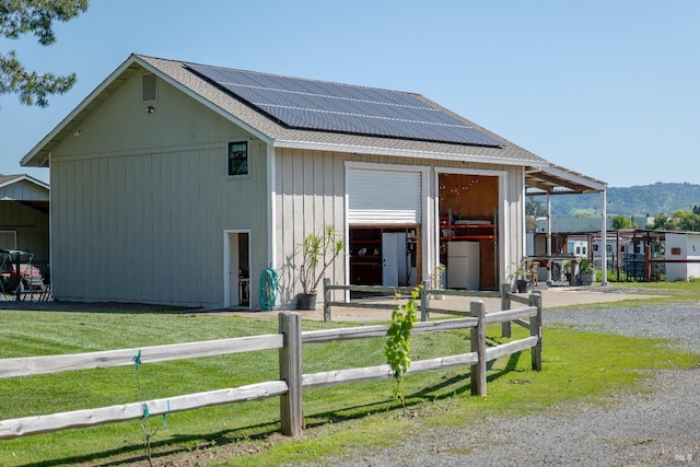 6820 Day Rd, Windsor, CA 95492 - view of front facade featuring roof mounted solar panels, an outdoor structure, and roof with shingles