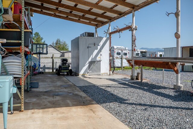 6820 Day Rd, Windsor, CA 95492 - view of patio featuring a shed, fence, and an outbuilding