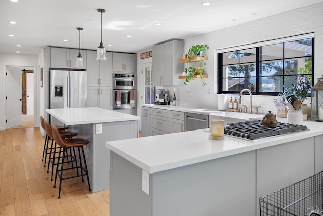 6820 Day Rd, Windsor, CA 95492 - kitchen with appliances with stainless steel finishes, gray cabinets, open shelves, recessed lighting, and light wood-style floors