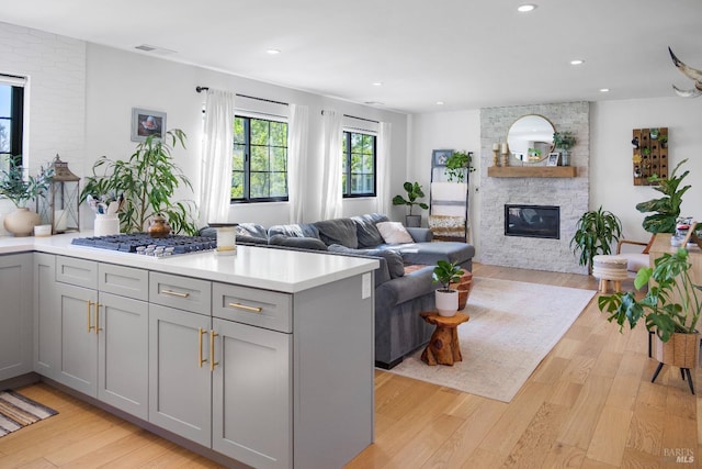 6820 Day Rd, Windsor, CA 95492 - living area with a fireplace, light wood finished floors, and recessed lighting