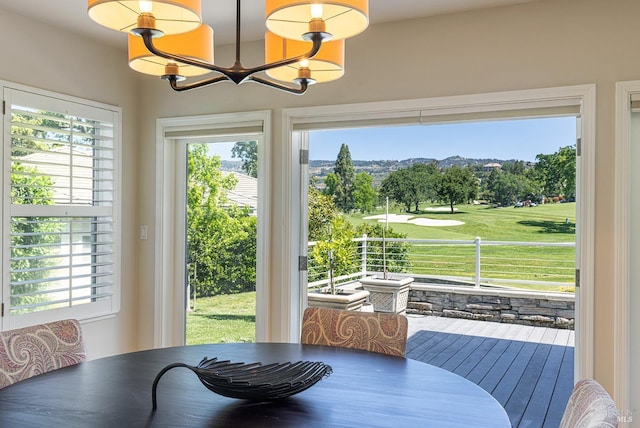 dining area featuring a chandelier and healthy amount of natural light