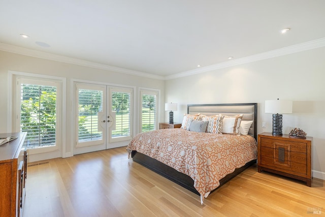 bedroom featuring access to exterior, light wood finished floors, french doors, multiple windows, and crown molding