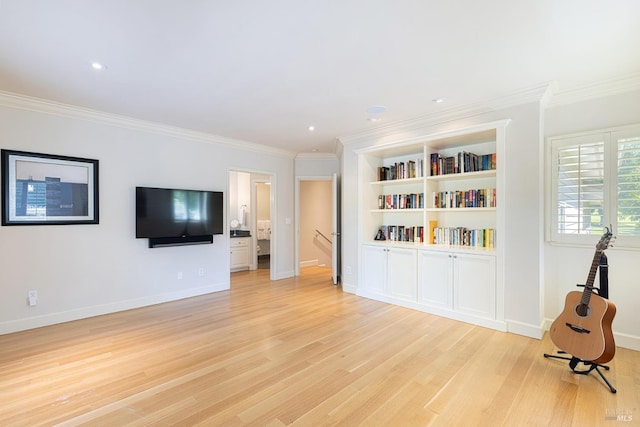 unfurnished living room featuring light wood-type flooring, ornamental molding, baseboards, and recessed lighting