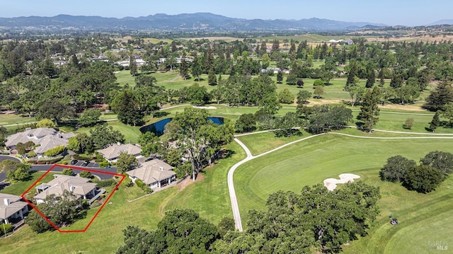 aerial perspective of suburban area featuring property boundaries highlighted, a water and mountain view, and a golf course
