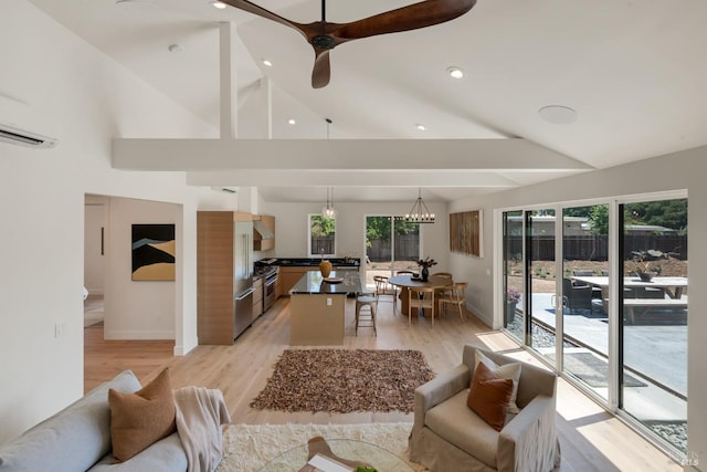 1575 Felder Rd, Sonoma, CA 95476 - living room featuring baseboards, a wall mounted air conditioner, light wood-style floors, beamed ceiling, and ceiling fan