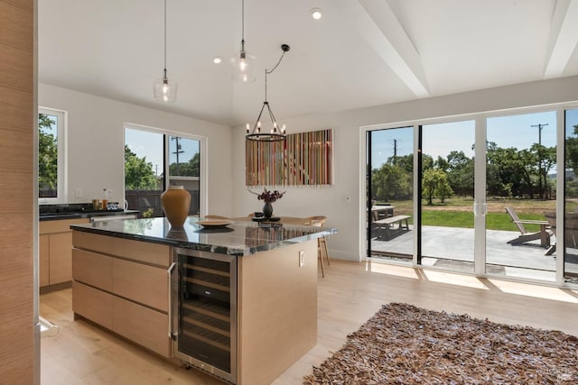 1575 Felder Rd, Sonoma, CA 95476 - kitchen with beverage cooler, modern cabinets, a kitchen island, pendant lighting, and light wood-type flooring