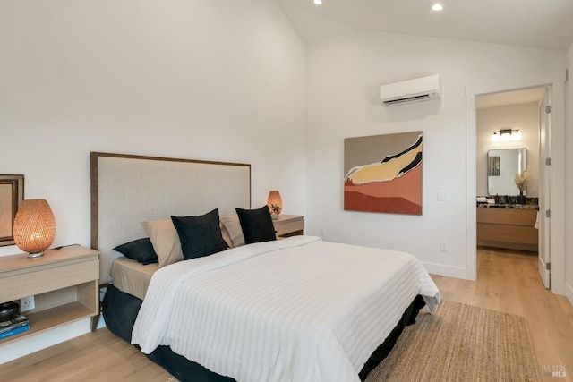 1575 Felder Rd, Sonoma, CA 95476 - bedroom featuring a wall mounted AC, vaulted ceiling, light wood-style flooring, recessed lighting, and baseboards