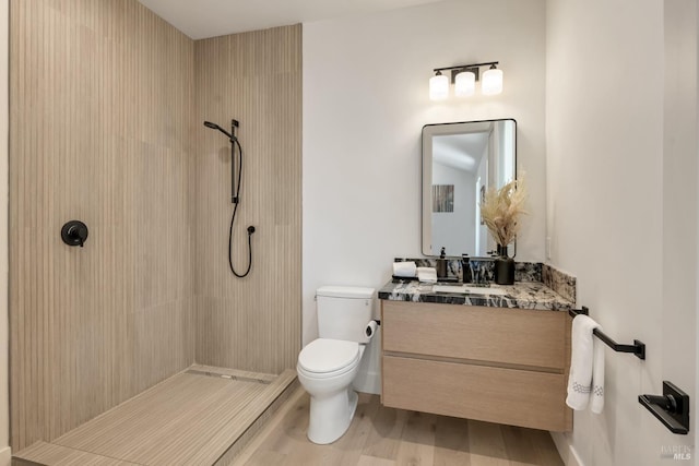 1575 Felder Rd, Sonoma, CA 95476 - bathroom with a tile shower, toilet, vanity, and wood finished floors