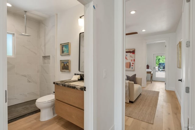 1575 Felder Rd, Sonoma, CA 95476 - full bathroom featuring wood finished floors, vanity, a walk in shower, recessed lighting, and toilet
