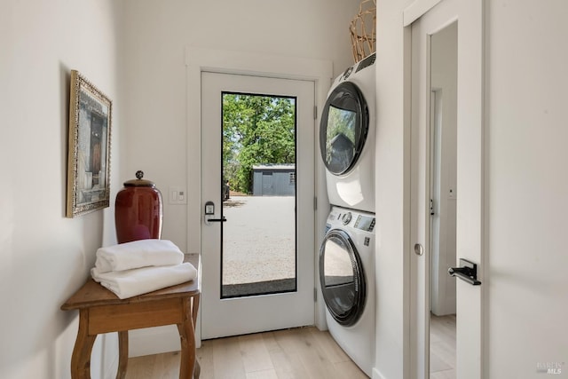 1575 Felder Rd, Sonoma, CA 95476 - clothes washing area with estacked washer and dryer and light wood finished floors