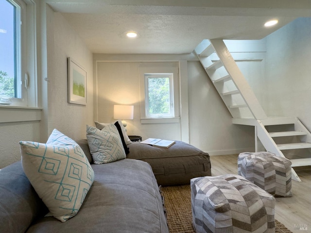 1575 Felder Rd, Sonoma, CA 95476 - living room with wood finished floors, stairs, a textured ceiling, and recessed lighting