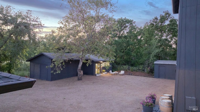 1575 Felder Rd, Sonoma, CA 95476 - yard at dusk featuring a storage unit and an outdoor structure