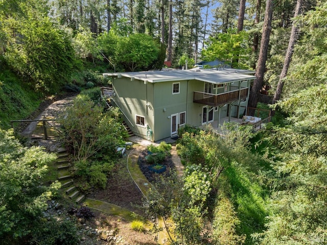 16 Ivy Ln, Woodacre, CA 94973 - view of property exterior featuring stairs, a wooden deck, and view of wooded area