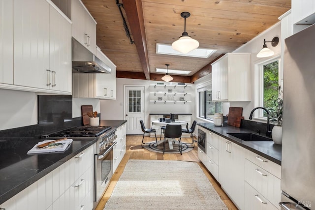 16 Ivy Ln, Woodacre, CA 94973 - kitchen with stainless steel appliances, a sink, wooden ceiling, under cabinet range hood, and dark countertops
