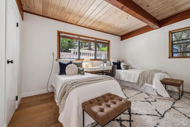 16 Ivy Ln, Woodacre, CA 94973 - bedroom with wood finished floors, baseboards, wooden ceiling, ornamental molding, and beam ceiling